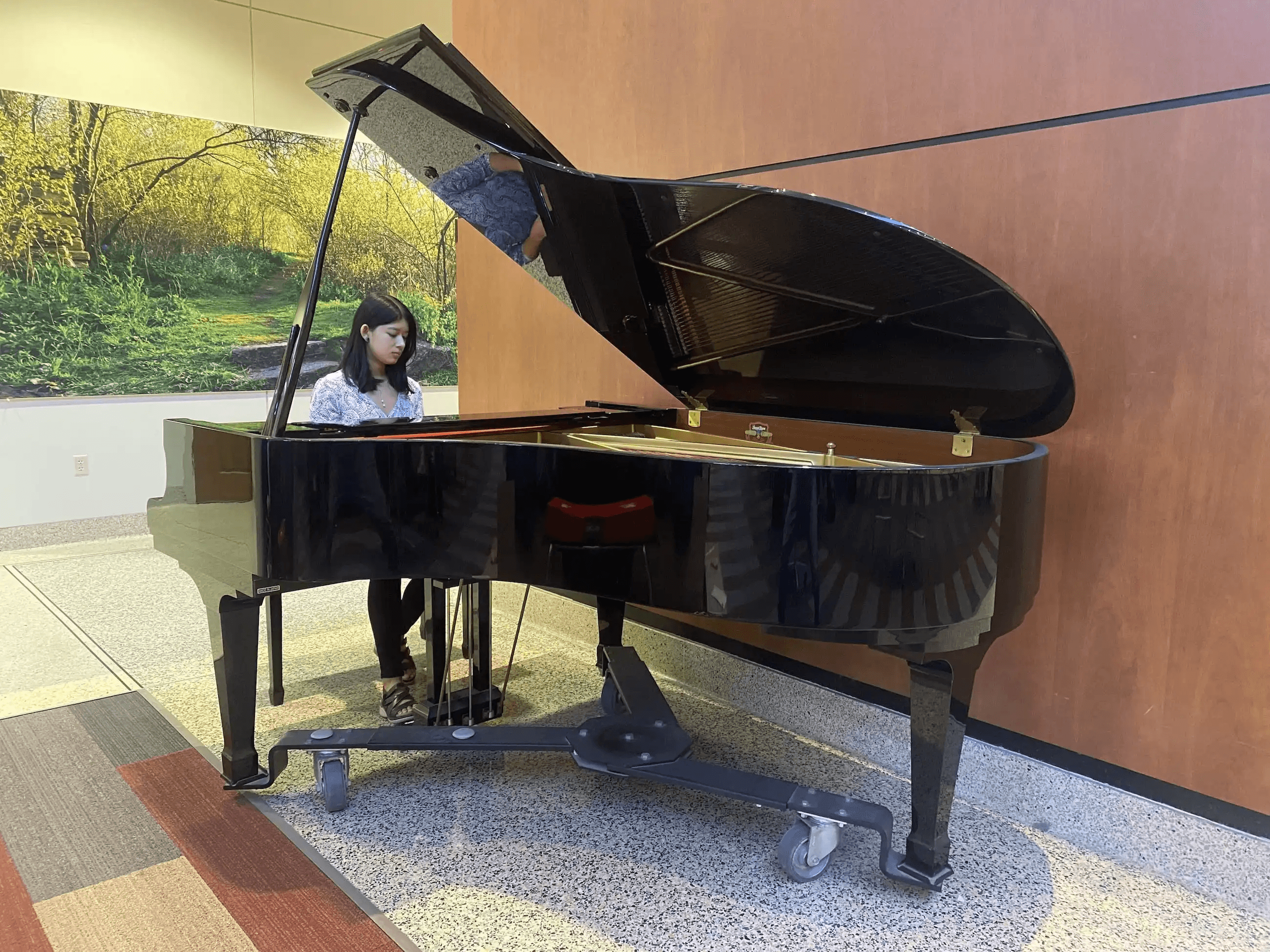 Aili playing a piano